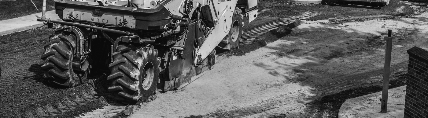 Full-depth reclamation machine stabilizing asphalt base during pavement reconstruction